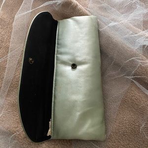 Mint green clutch w/ black lining